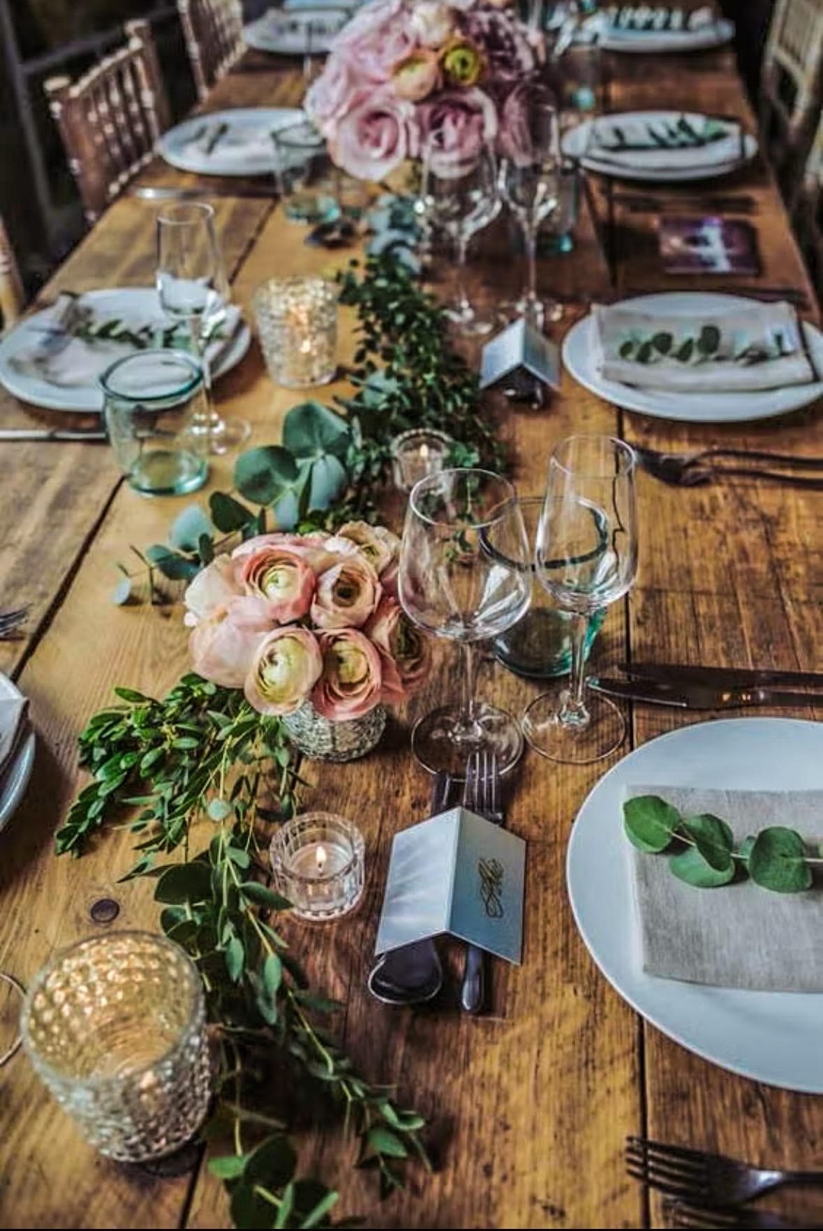 Rustic wedding tablescape with blush florals, eucalyptus, and candlelight, designed by Lindsey Rose Events